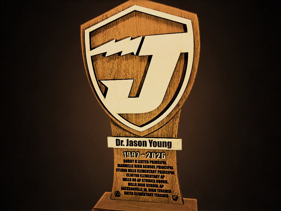 Shield-shaped career award with a layered J emblem and engraved plate for Dr. Jason Young, 1997 to 2026