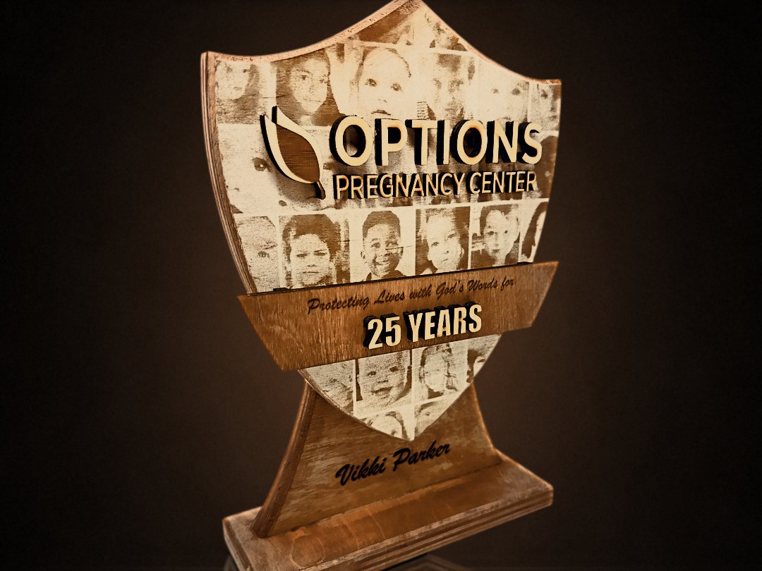 Options Pregnancy Center 25-year shield award with an engraved photo collage