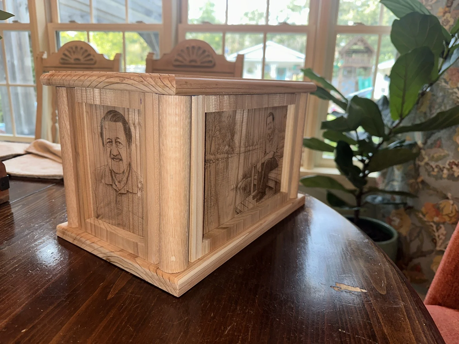 Custom cedar urn displayed on a wood table