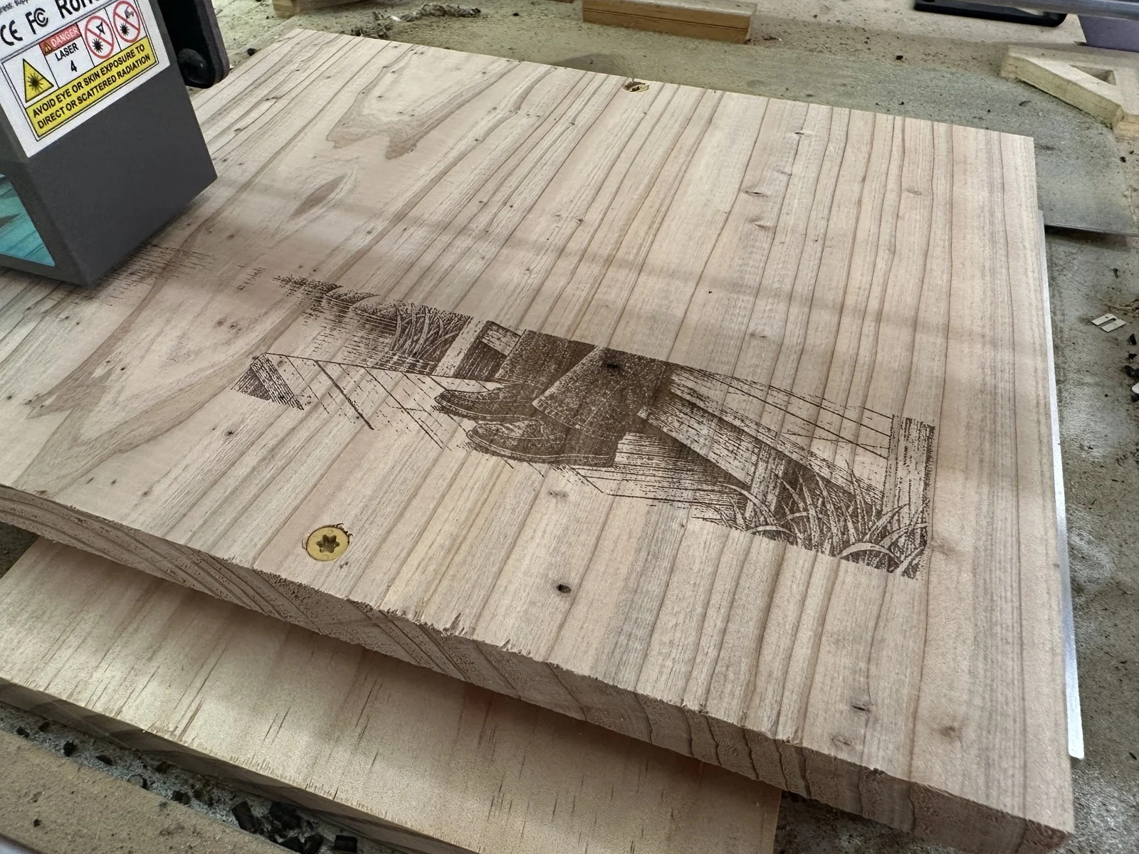 Portrait engraving on a cedar panel before assembly